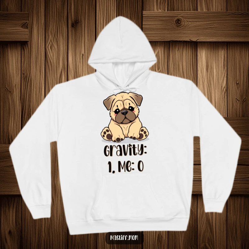 Funny Kawaii Mastiff puppy tripping over its own giant paws, depicted in a cozy hoodie, a heartwarming funny gift.